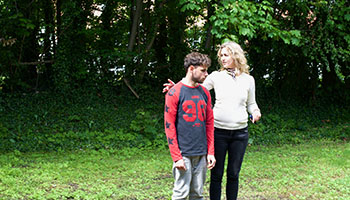 Photo of a resident and employee in the garden
