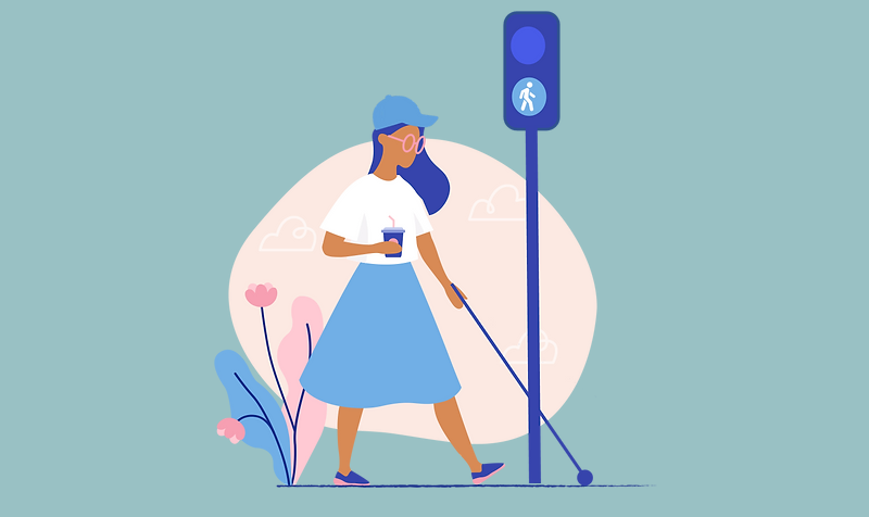 Kvinde, der går med mobilitystok i lyskryds.